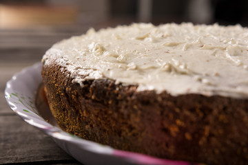 biscuit cake with vanilla cream close-up on a rustic table