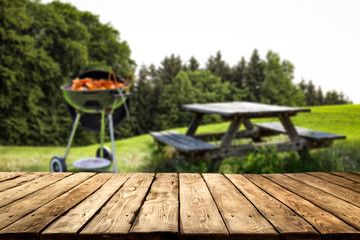 desk of free space and spring time in garden with grill 
