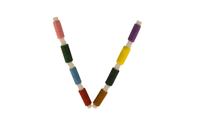 Isolated Font English or Latin Letter V made of colorful spools of thread for sewing on white background