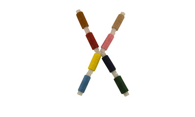 Isolated Font English or Latin or Russian letter X colorful spools of thread for sewing on white background