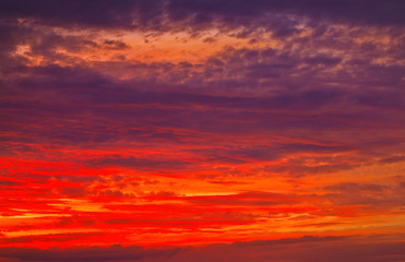 Beautiful Twilight sky background. Colorful Fiery orange and red sunset sky.