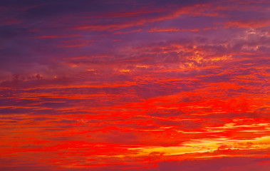 Beautiful Twilight sky background. Colorful Fiery orange and red sunset sky.