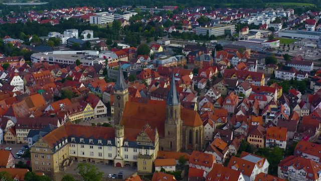 Aerial view from the old part of the city Öhringen in Germany. Tilt up from the old town to the horizon.