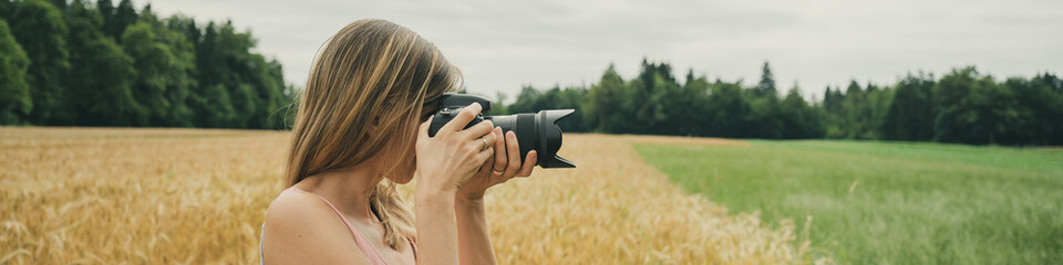Female photographer taking photos of beautiful nature