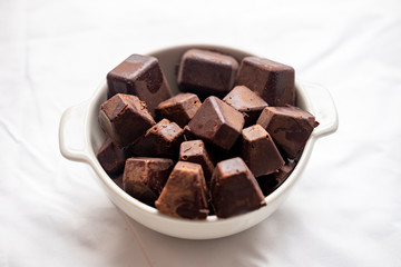 pure cocoa pastes inside white bowl