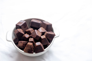 pure cocoa pastes inside white bowl