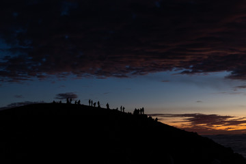 People on hill at Sunrise