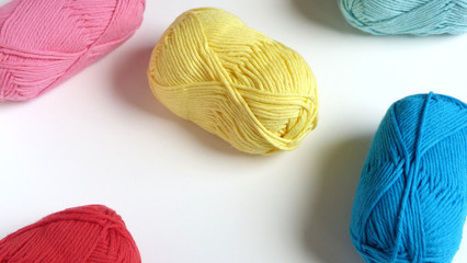 Colorful Yarn on a White Background | Red, Pink, Yellow, and Blue Yarn