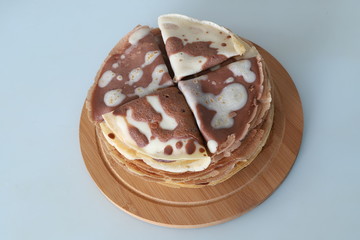 chocolate pancakes on a wooden tray