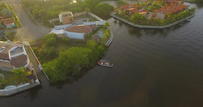 Drone view of a boat in the Higuerote canal's mangroves in Venezuelae