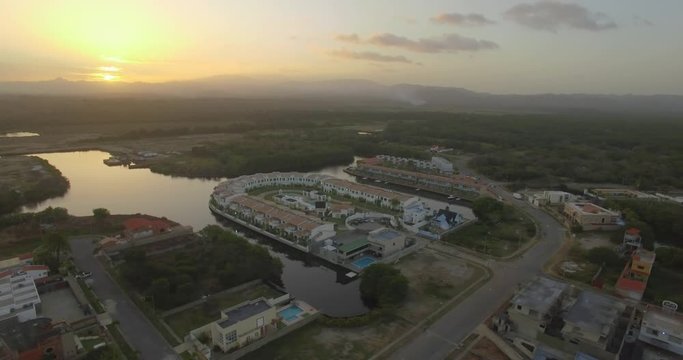 Aerial view of a sunset over Higuerote houses, in Venezuela