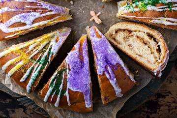 King cake for Mardi Gras, New Orlean traditional pastry with a plastic baby © fahrwasser