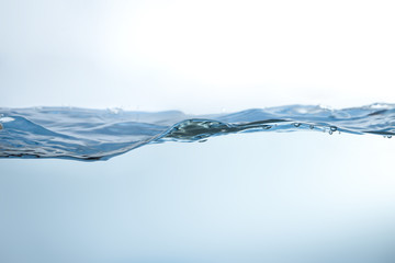 Water splash. Aqua flowing in waves and creating bubbles. Drops on the water surface feel fresh and...