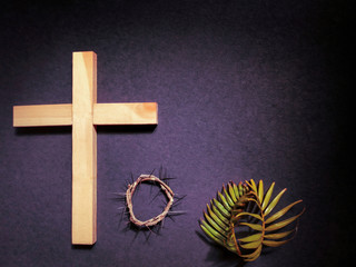 Lent Season,Holy Week and Good Friday concepts - photo of wooden cross,crown of thorns and palm...
