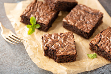 Freshly baked homemade brownies on a parchment paper