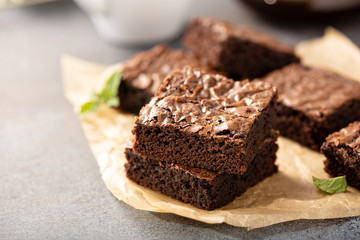 Freshly baked homemade brownies on a parchment paper