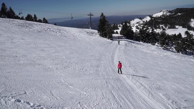 People are skiing in Uludag on a beautiful day,