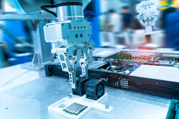 Robotic arm installing a computer chip and fan with Automation system control application