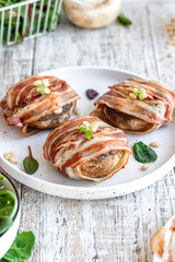 Baked mushrooms stuffed with cheese and pine nuts
