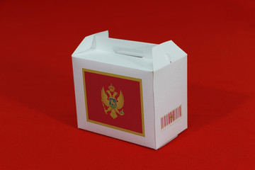 Montenegro flag on white box with barcode and the country color flag on blue background. The...