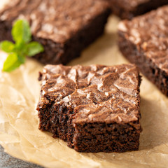 Freshly baked homemade brownies on a parchment paper