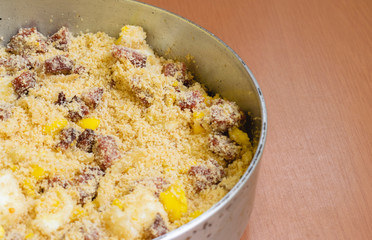 bacon farofa in the pan on the wooden table