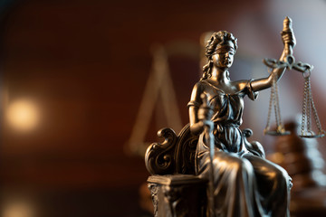 Lawyers office concept. Law symbols composition: gavel, scale and Themis statue.
