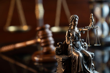 Lawyers office concept. Law symbols composition: gavel, scale and Themis statue.