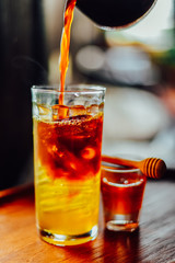 Iced coffee with  fresh honey   or iced americano  In Glass On wood tabel, The drink menu