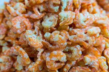 Dried shrimp, ingredient frequently used in Thai and Asian cuisine famously in Somtum, full frame in seafood market.