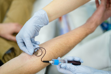 TAKING BLOOD IN A TEST FROM A MAN