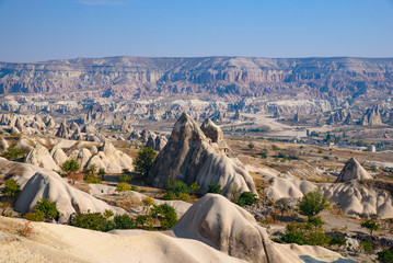 Rock formations of mountain ridges, valleys and pinnacles at Göreme National Park, Cappadocia,...