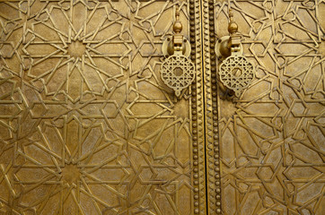 Detail of the intricate engraving on the brass doors to the Dar El Makhzen palace in Fes Morocco