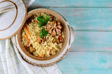 Pilaf with carrot, garlic and meat.