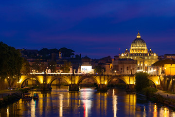 Fototapeta na wymiar Sunset view of St. Peter's Basilica, Ponte Sant'Angelo, and Tiber River in Rome, Italy