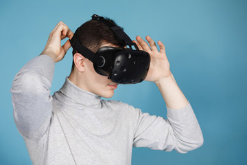 Guy plays with virtual reality glasses