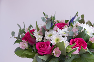 Pink roses and white chrysanthemums as background. Bouquet close-up. Postcard,
