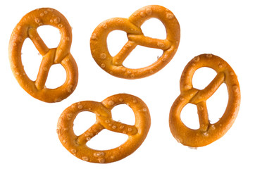 Pretzel with salt. Set or collection of baked pretzels with salt isolated on white background. Snacks for beer