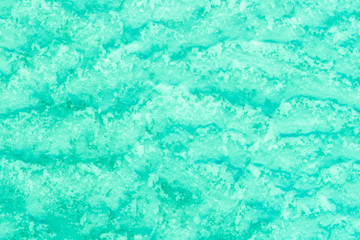 blue texture of an snow surface with pure ice white wave , blue cold clear cryslallized wall background ,decorative plaster background close up , abstract macro wallpaper