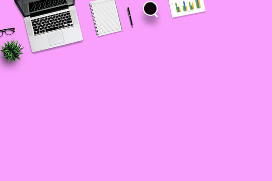 Top view office desk and supplies, with copy space. Creative flat lay photo of workspace desk/Panoramic banner and isolated on pink background