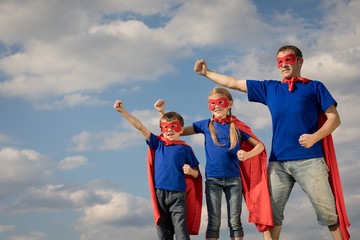 Father and children playing superhero at the day time. © altanaka