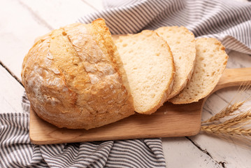 Fresh bread on wooden table. Top view with space for your text