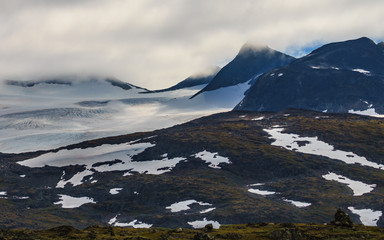 Fototapeta premium Mountains with ice glacier. Road Sognefjellet, Norway