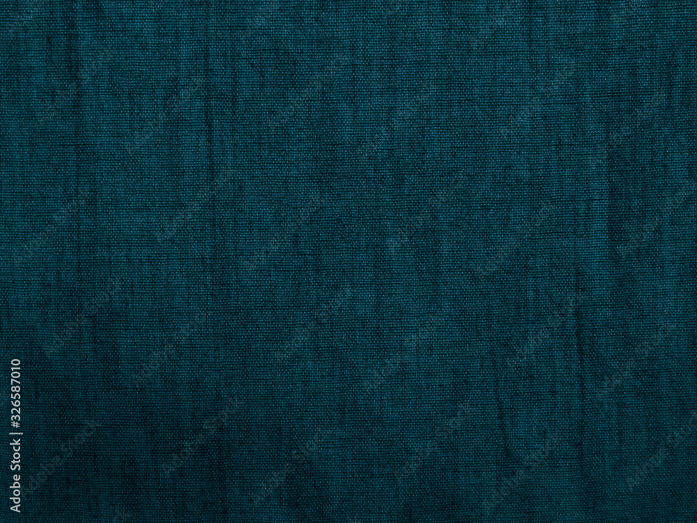 Wall mural Blue green fabric background. Rough fabric texture. Dark turquoise vintage background. Blue abstract grunge backdrop.