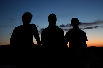 Fototapeta premium Silhouette group of young men 