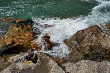 An image of old binoculars and a compass.