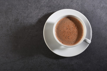 Cup of coffee on gray stone table