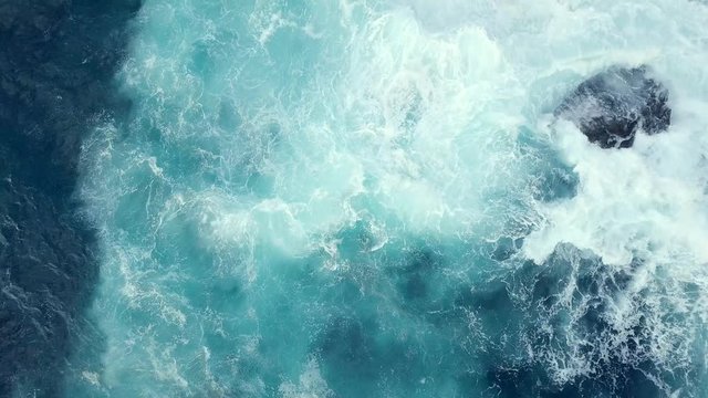 Aerial view of Atlantic ocean with crashing waves.