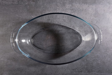 Empty glass bowl on the gray stone texture