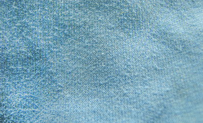 Fabric texture close-up. Warm dense fabric of blue color. Winter scarf.